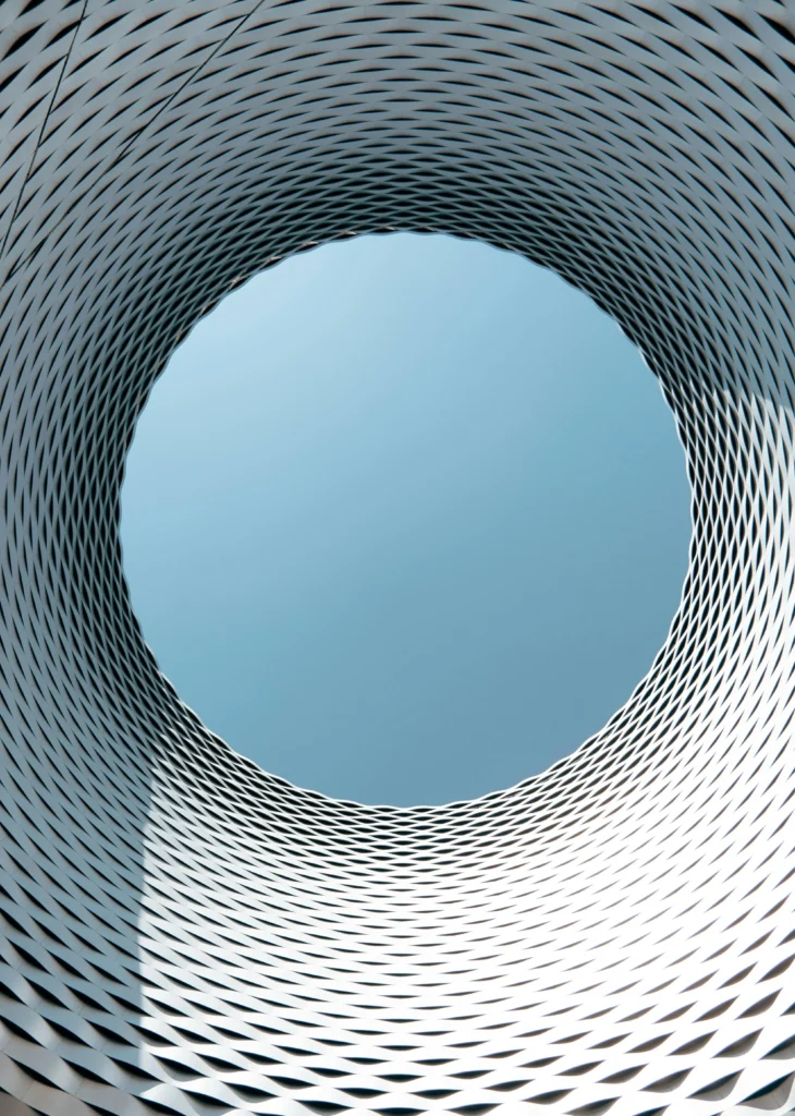 Circular architectural opening symbolizing Swiss precision, clarity, and structural harmony — ORIGIN SWISS